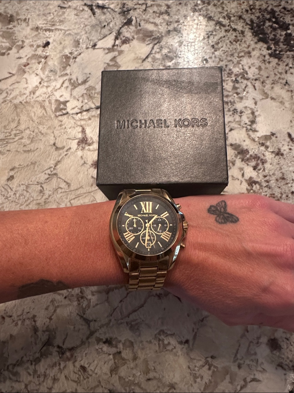 Man or woman’s Michael Kors Gold tone big watch.